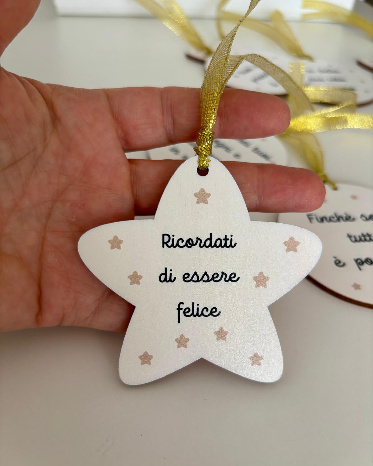 stella natalizia con frase motivazionale "ricordati di essere felice"
